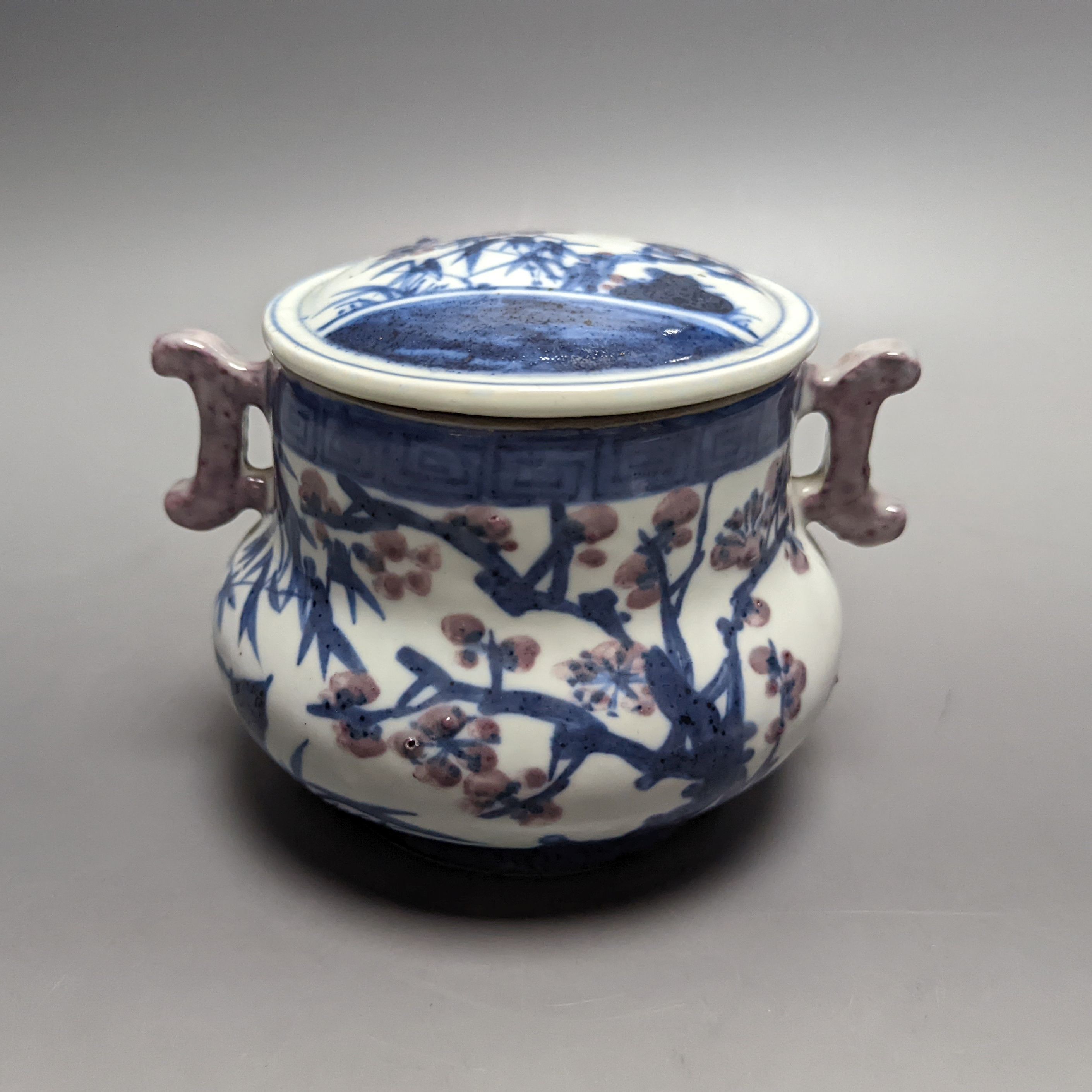 A Chinese underglaze blue and copper red jar and cover, Xuande six character mark but later 12cm